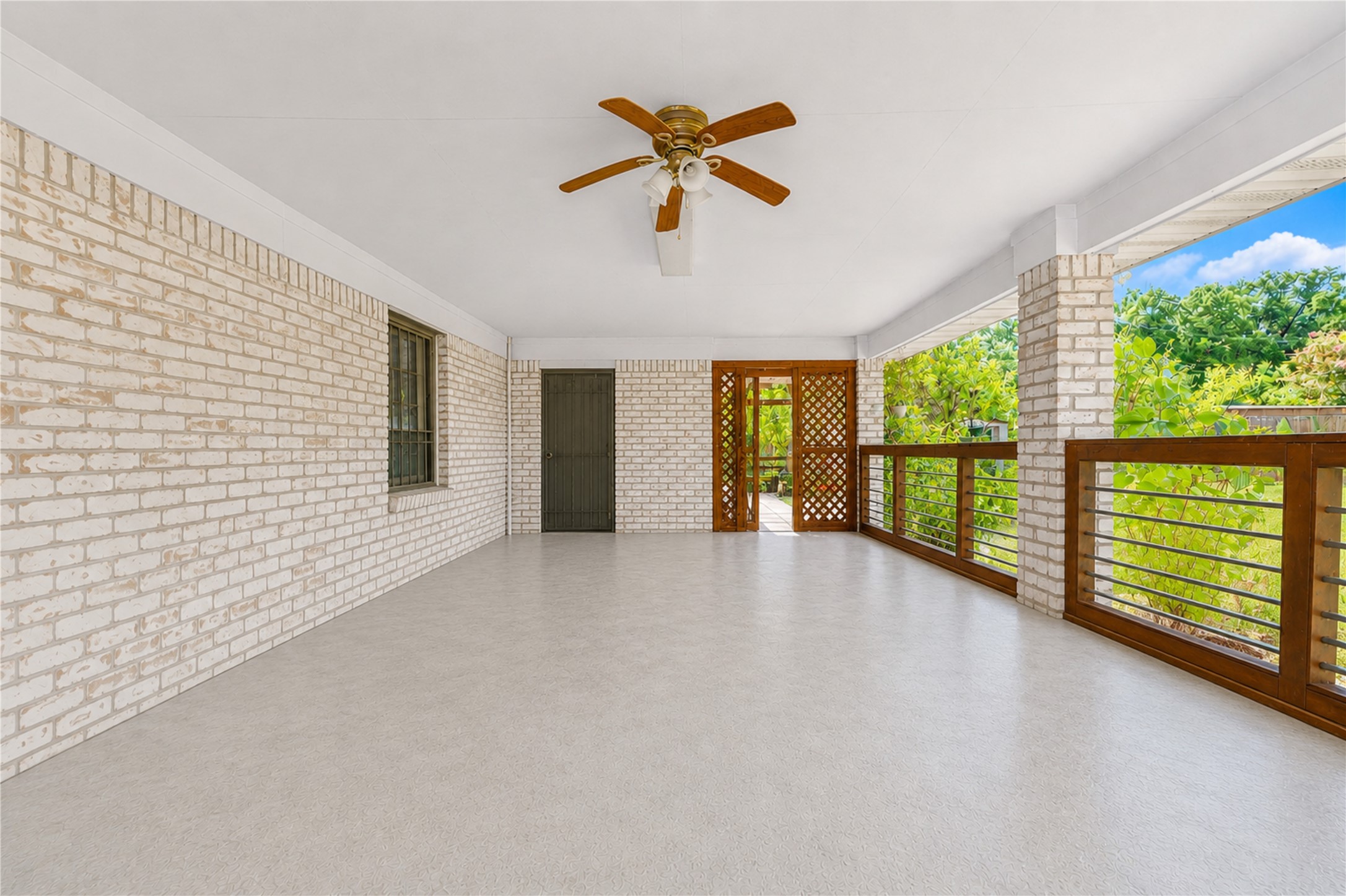 4018 Blalock Road Houston, TX 77080 - Photo 34 of 35 Covered open-air area with concrete flooring, perfect for use as a functional carpool/carport or easily adaptable into a spacious patio-terrace for outdoor living.