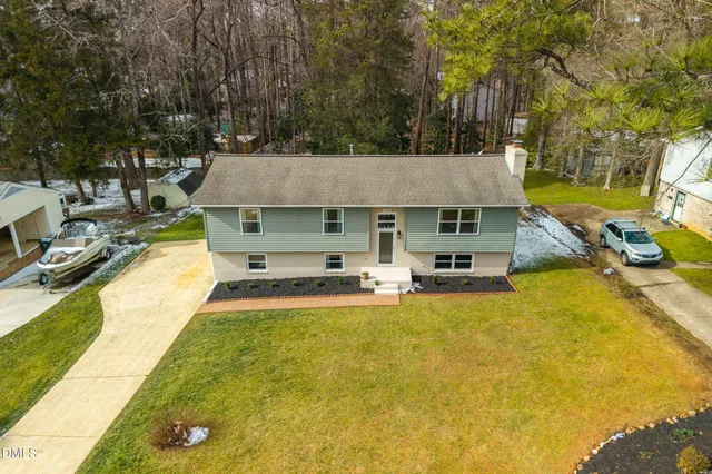 an aerial view of a house with a swimming pool