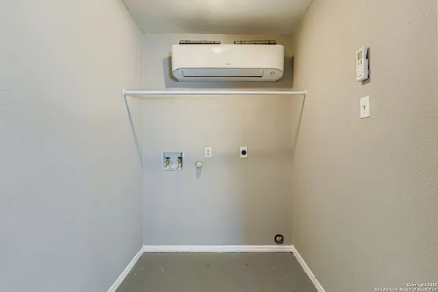 a view of storage and utility room with washer and dryer