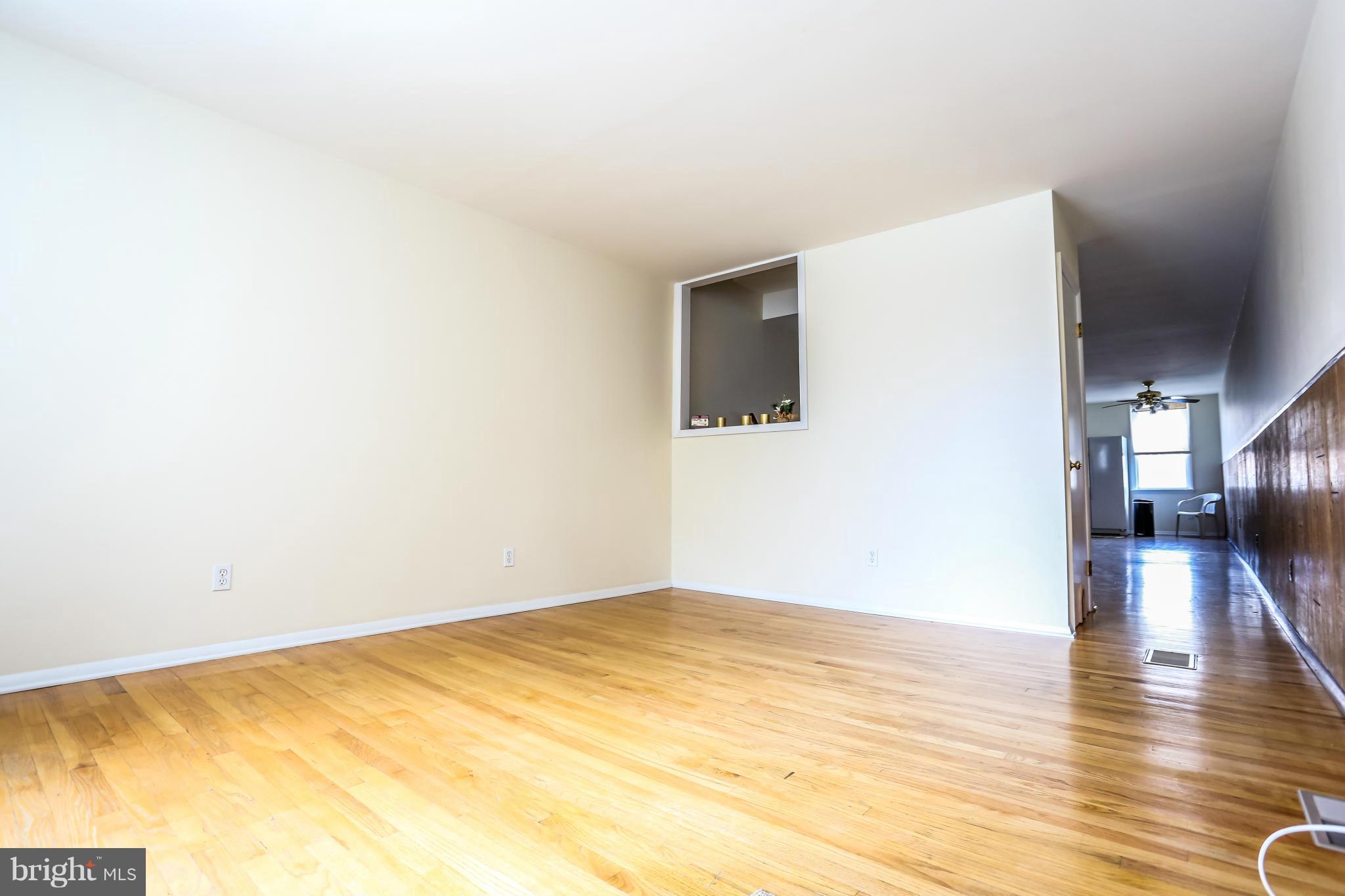 3811 Roland Avenue Baltimore, MD 21211 - Photo 3 of 25 Open LR w/ HW floors. Lots of natural light