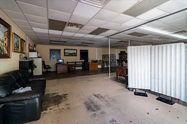 a living room with furniture oven and a window