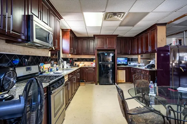 a room with lots of appliances and furniture