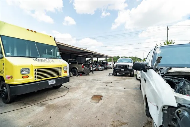 a view of a patio with table and chairs a barbeque with wooden fence
