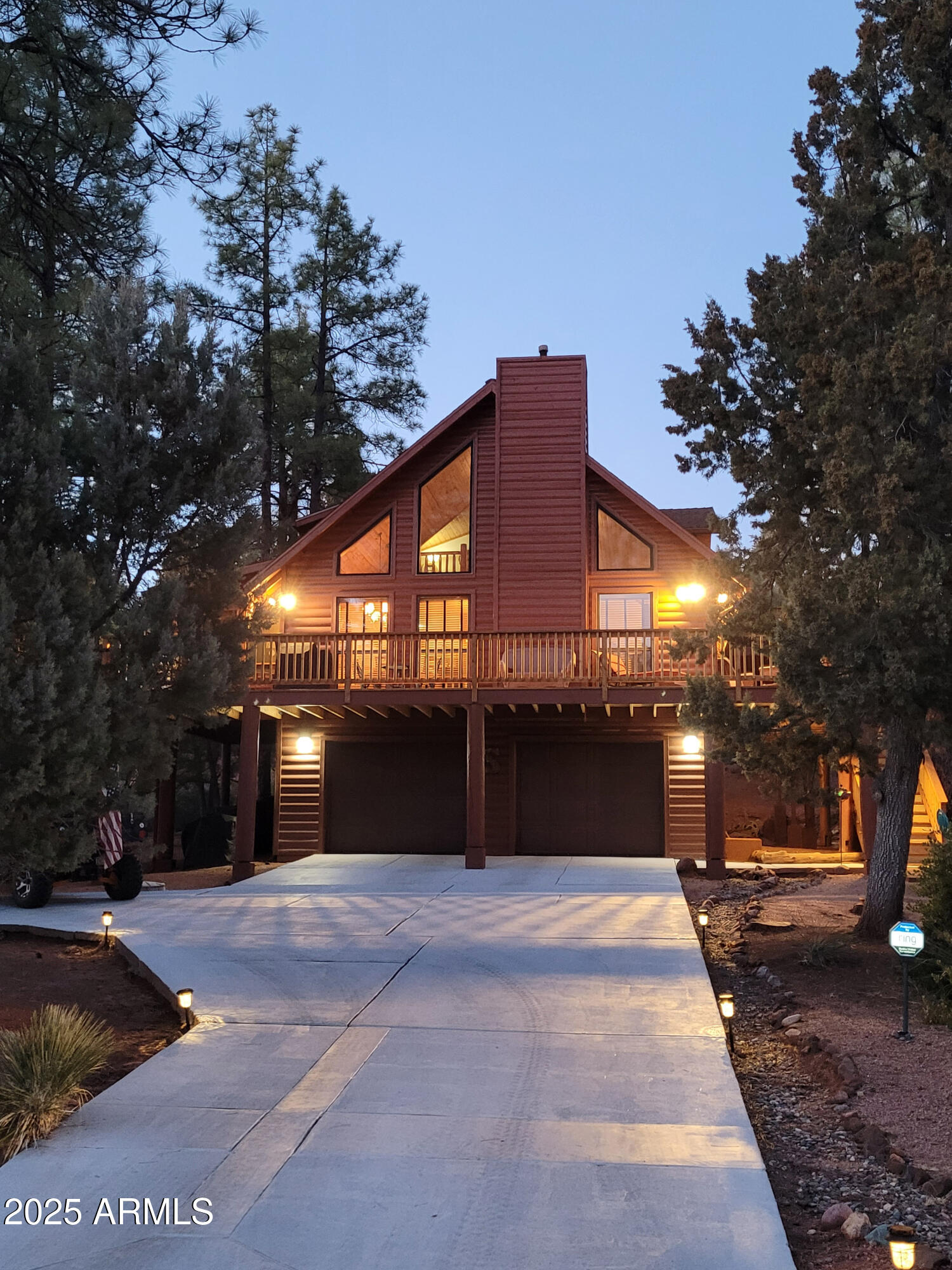 5579 Solitude Trail Loop Pine, AZ 85544 - Photo 3 of 50 a front view of a building with a yard