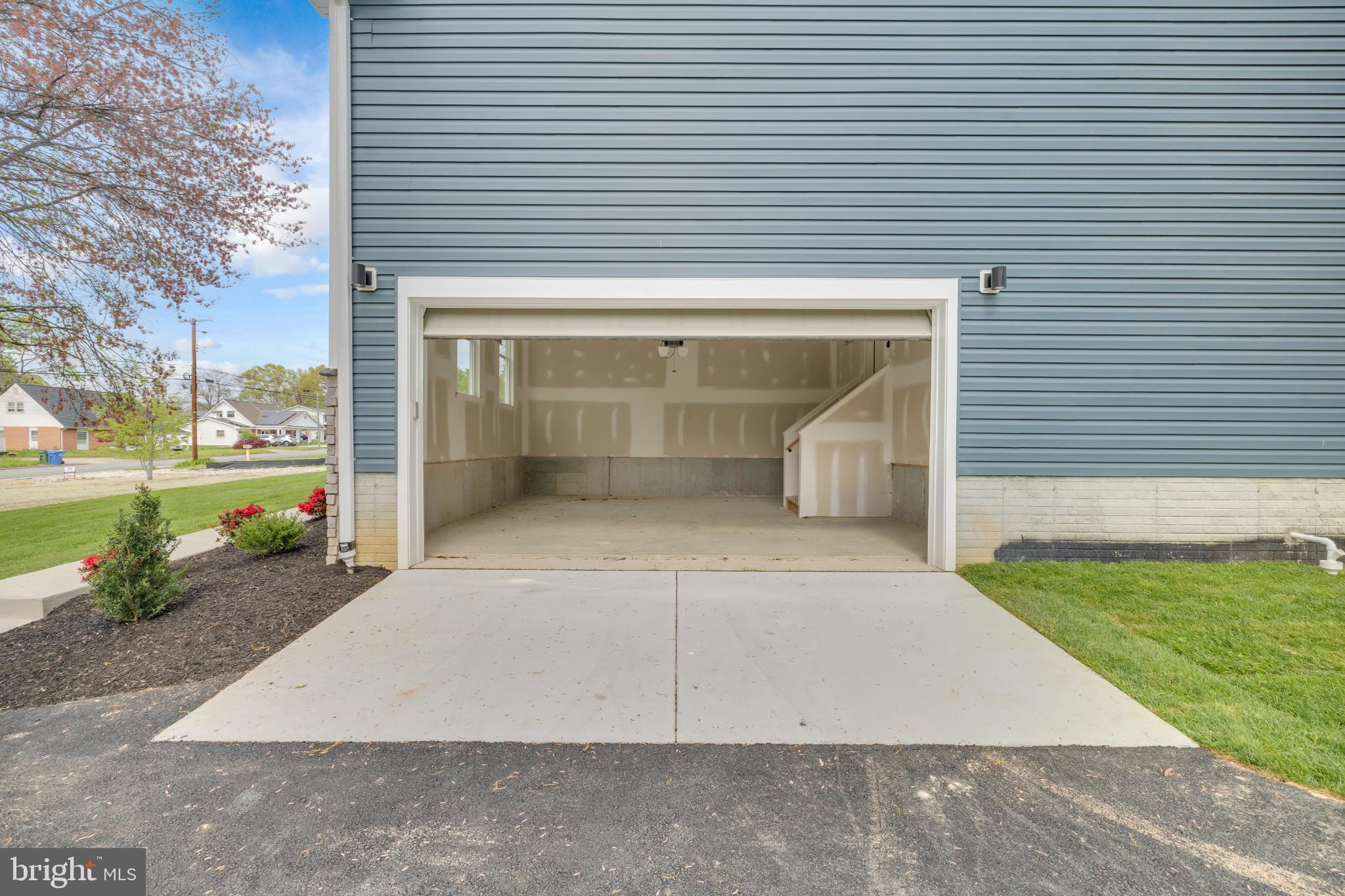413 Trimble Road Joppa, MD 21085 - Photo 44 of 54 Spacious garage ready for your vehicles.