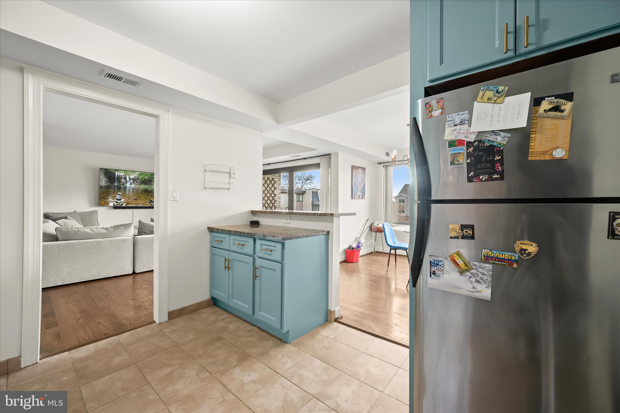 10851-10859 Amherst Avenue, Unit 202 Silver Spring, MD 20902 - Photo 13 of 32 a utility room with cabinets and washer