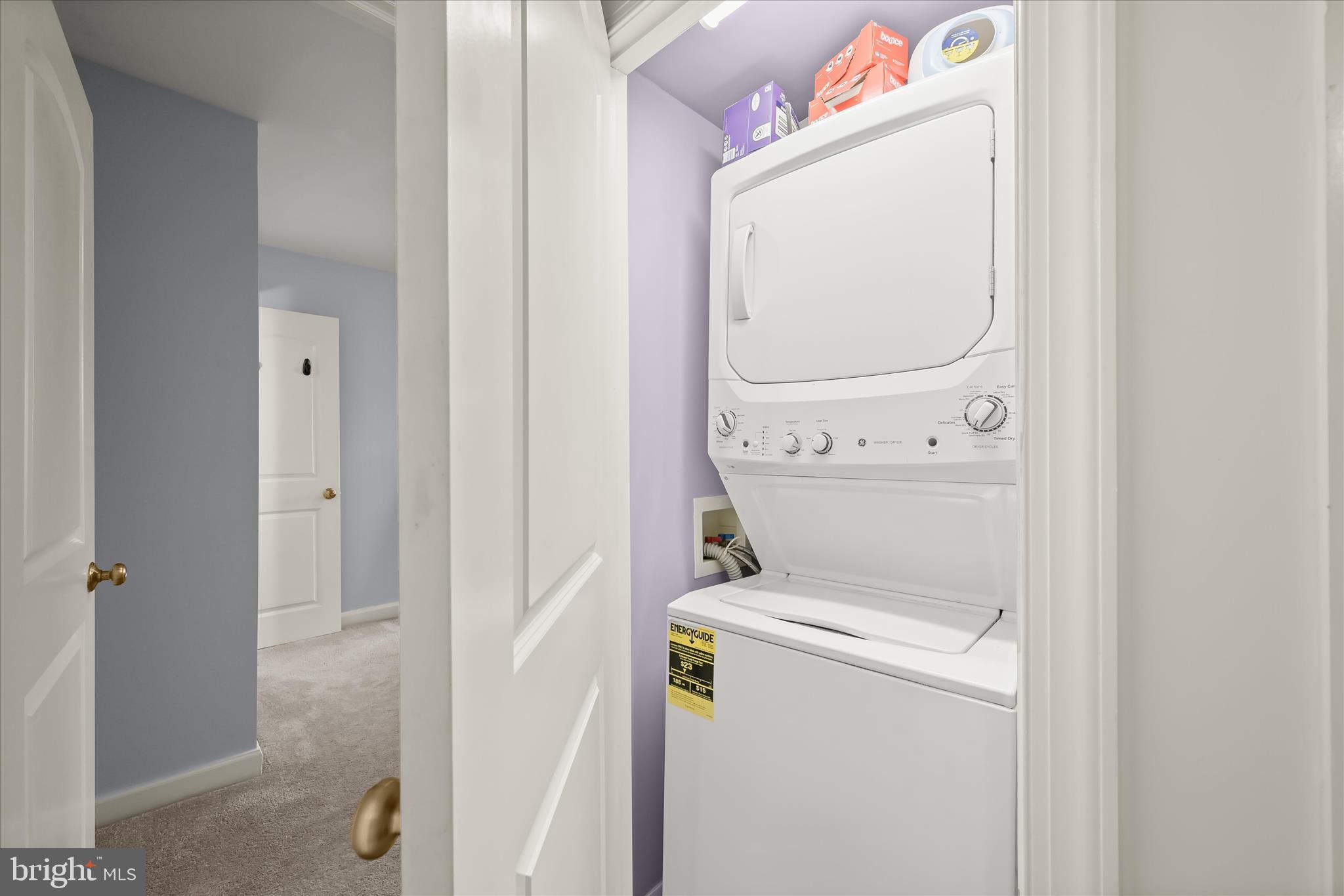 10851-10859 Amherst Avenue, Unit 202 Silver Spring, MD 20902 - Photo 23 of 32 a utility room with dryer and washer