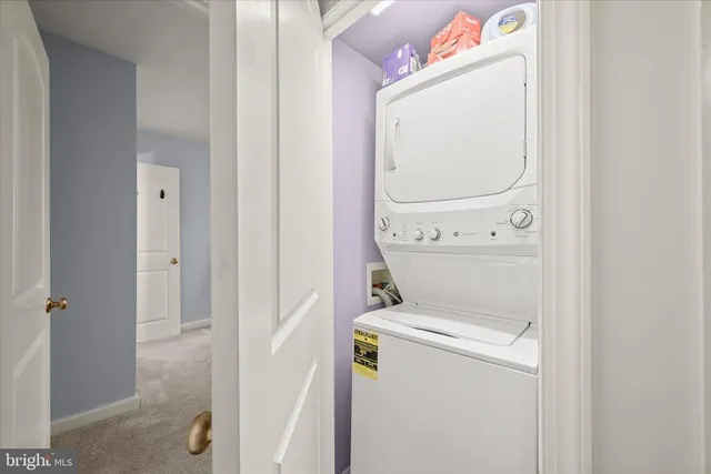 a view of an entryway with a bookshelf