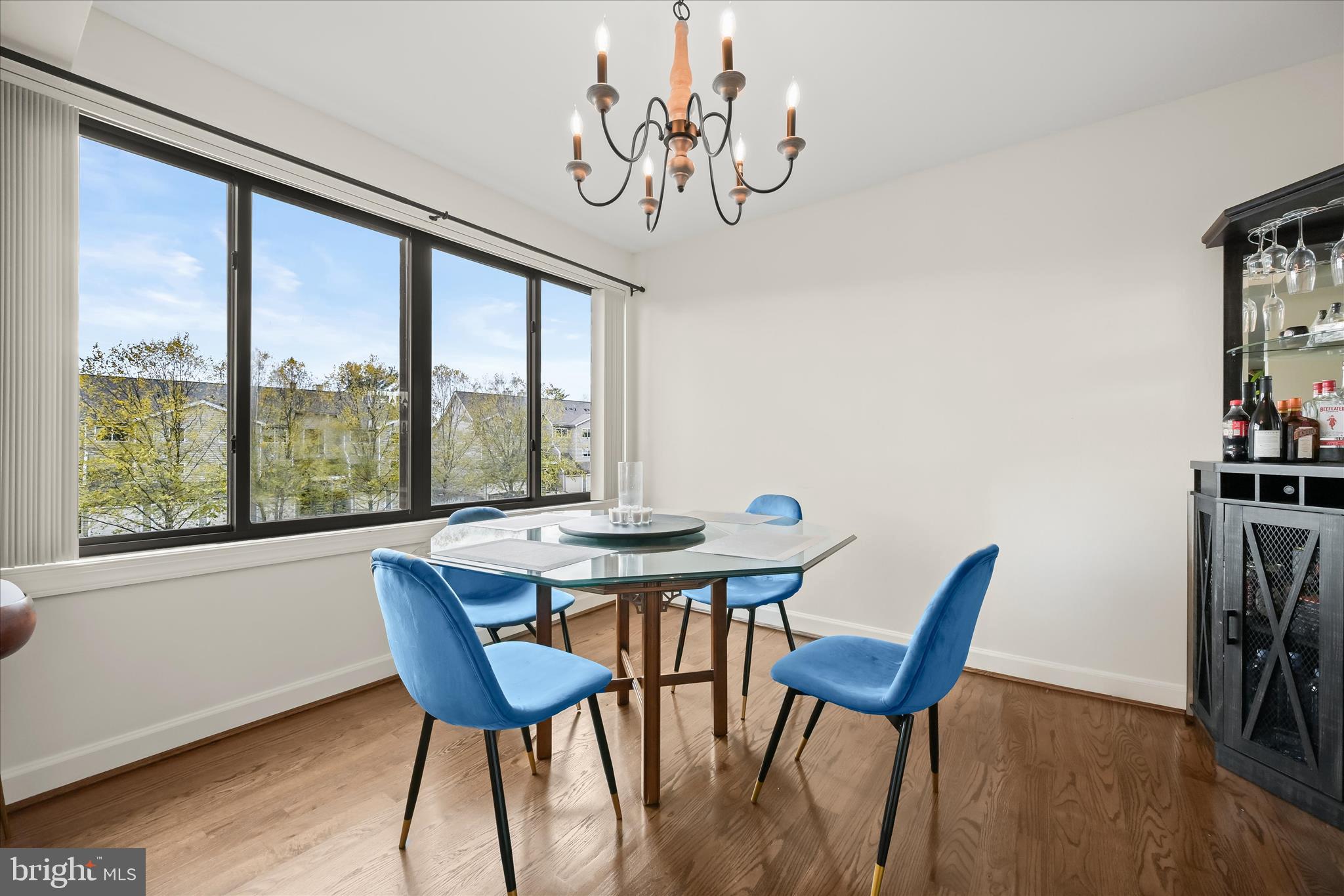 10851-10859 Amherst Avenue, Unit 202 Silver Spring, MD 20902 - Photo 2 of 32 a view of a dining room with furniture window and wooden floor
