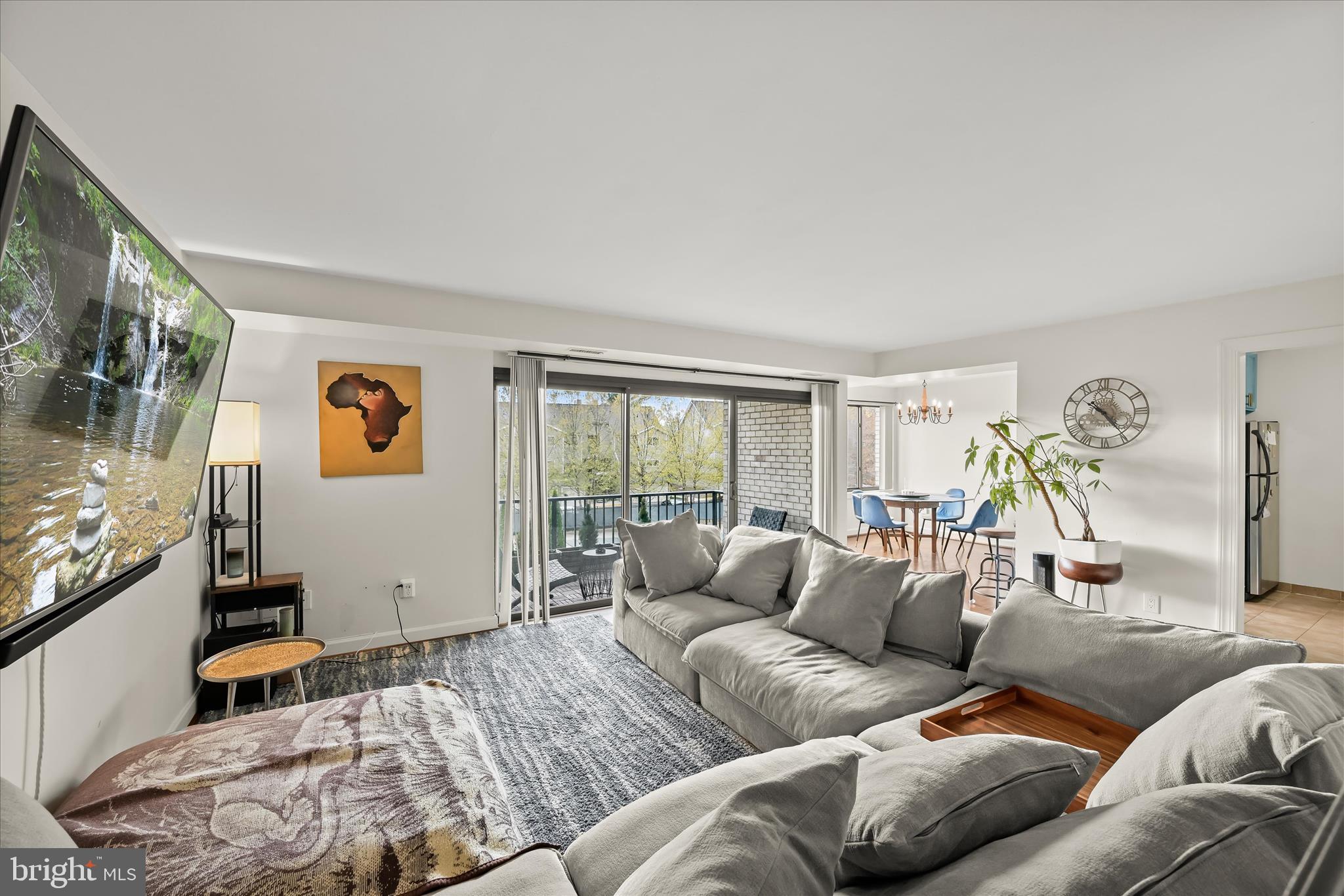 10851-10859 Amherst Avenue, Unit 202 Silver Spring, MD 20902 - Photo 4 of 32 a living room with furniture and a window