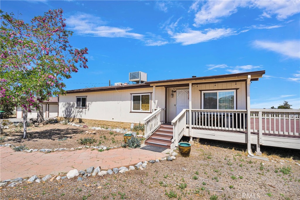 1616 Walnut Road Pinon Hills, CA 92372 - Photo 1 of 1 a front view of a house with a yard