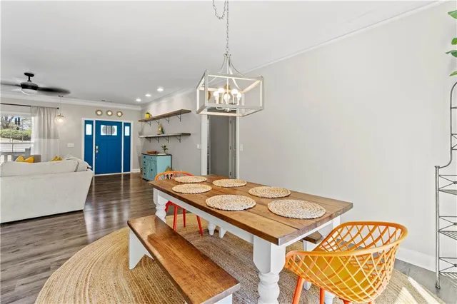 a dining room with a table and chairs