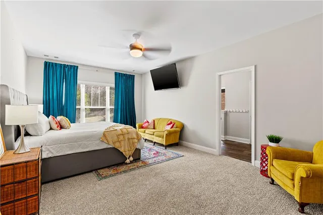 a bedroom with furniture and a window