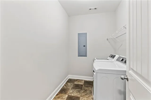 a utility room with dryer and washer