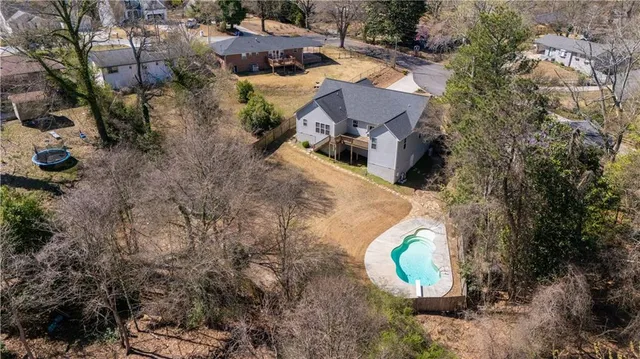 an aerial view of a house with outdoor space