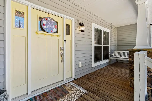 a view of an entryway with wooden floor