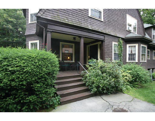 42 Crafts Road Brookline, MA 02467 - Photo 2 of 5 a front view of a house with a garden