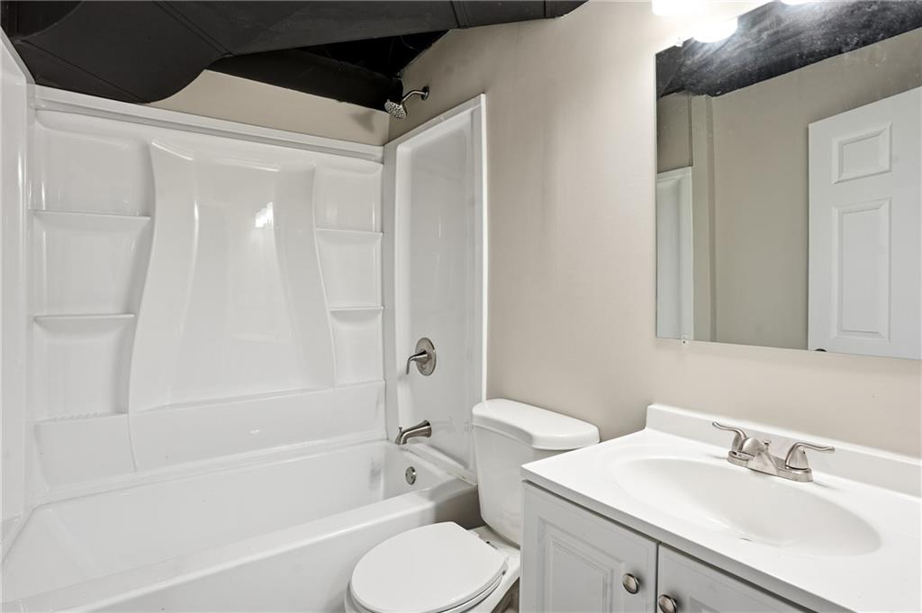 3130 Gay Drive Decatur, GA 30032 - Photo 12 of 28 a bathroom with a sink toilet and shower