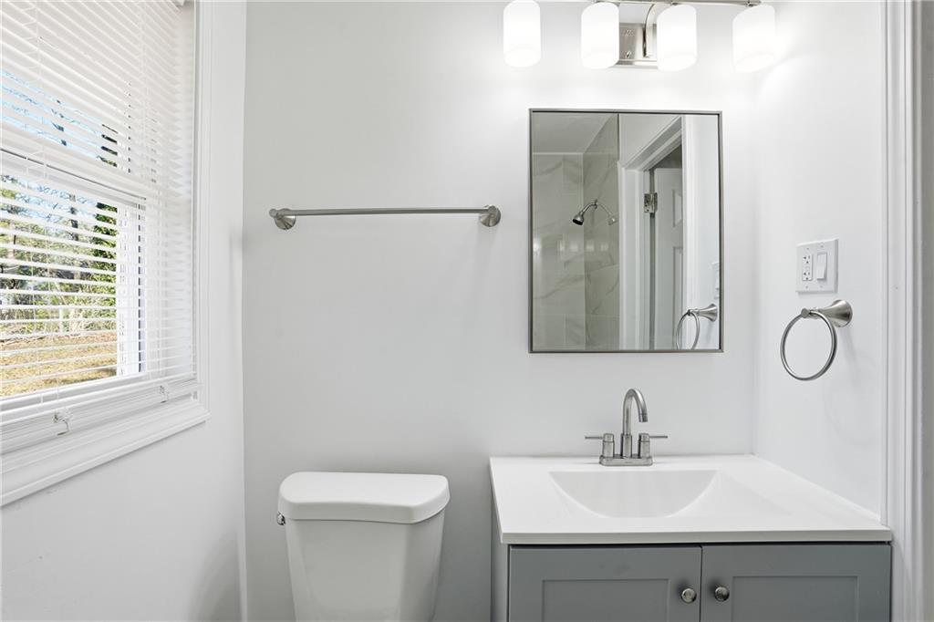 3130 Gay Drive Decatur, GA 30032 - Photo 19 of 28 a bathroom with a sink toilet and mirror