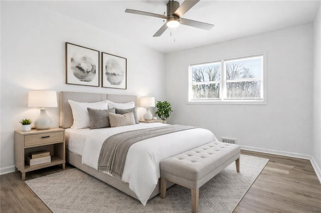 3130 Gay Drive Decatur, GA 30032 - Photo 20 of 28 a bedroom with a bed and a painting on the wall