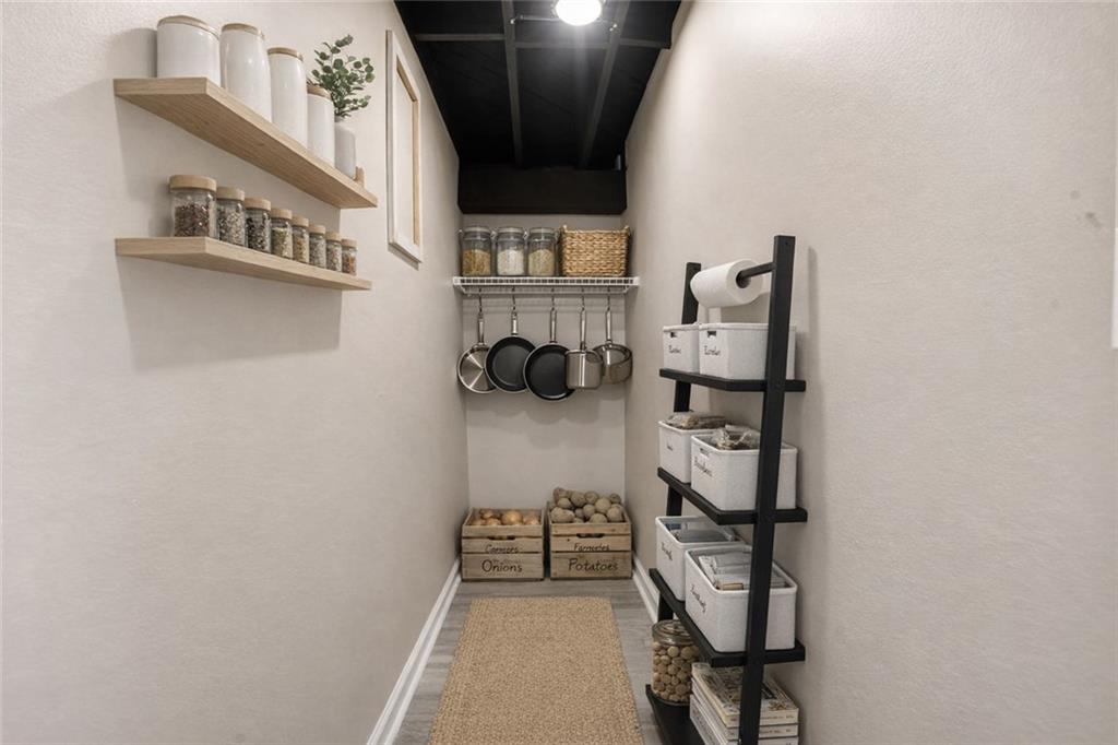 3130 Gay Drive Decatur, GA 30032 - Photo 26 of 28 a view of walk in closet with clothes and shoes