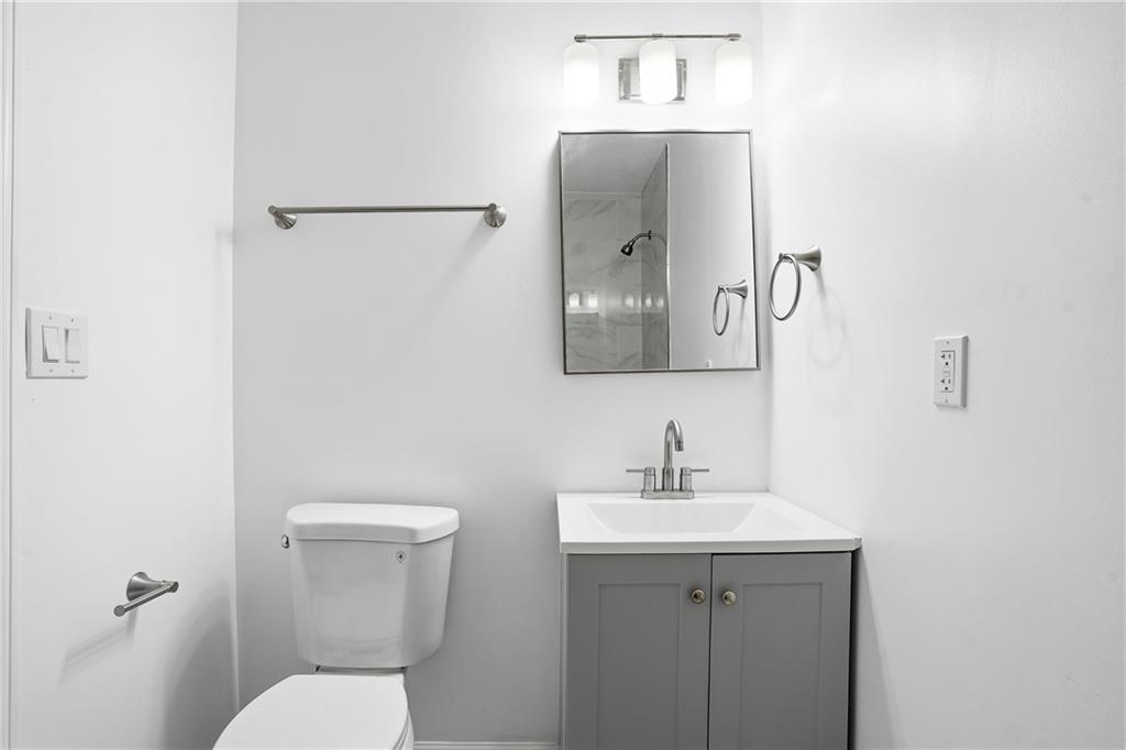 3130 Gay Drive Decatur, GA 30032 - Photo 7 of 28 a bathroom with a toilet sink and mirror