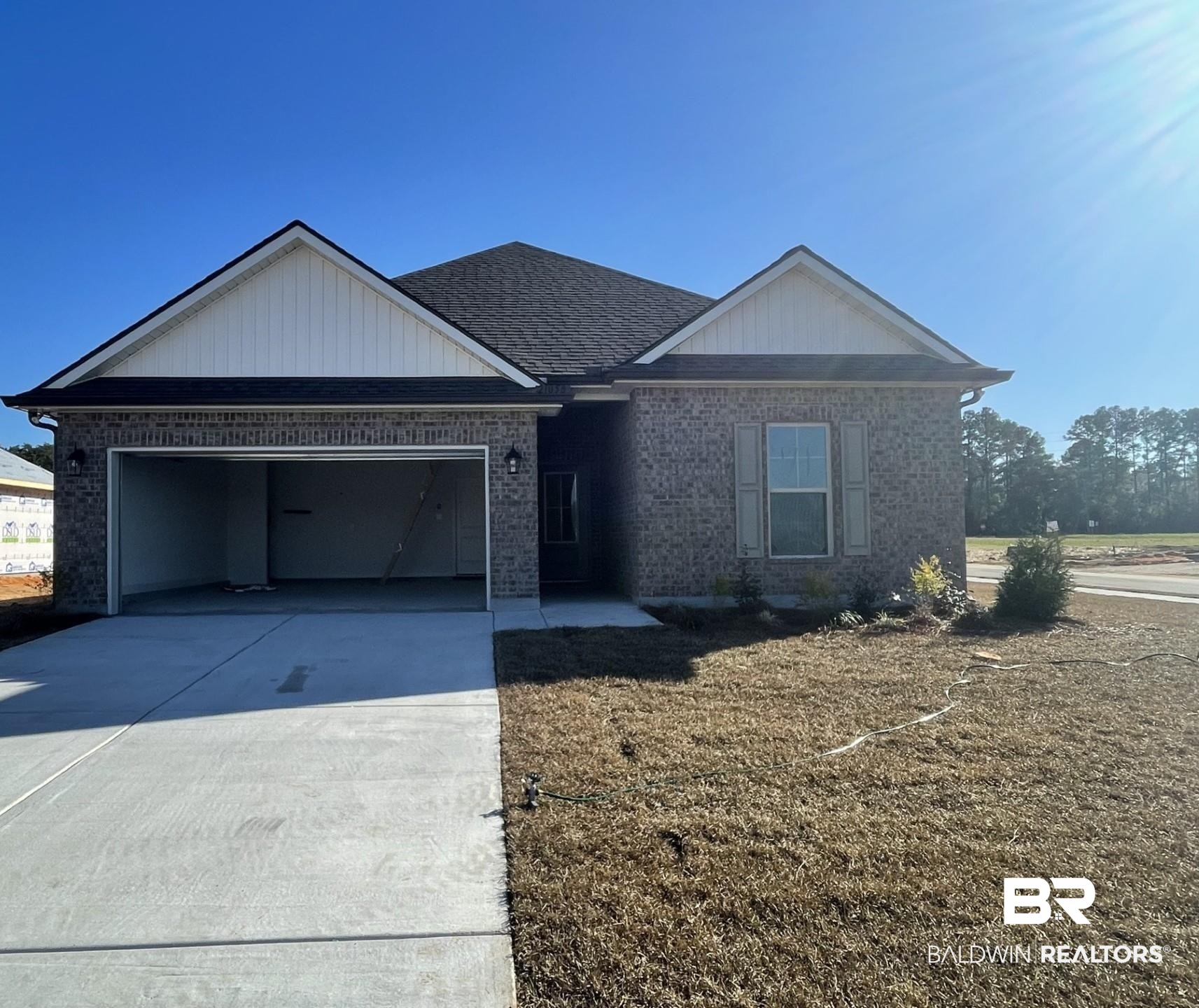 21056 Central Avenue Silverhill, AL 36576 - Photo 1 of 3 Ranch-style home featuring a garage
