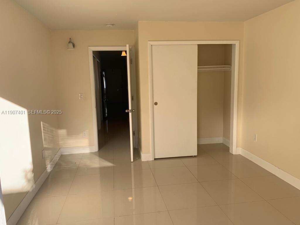 1511 Northeast 117th Street, Unit 2 Miami, FL 33161 - Photo 13 of 14 a view of an empty room