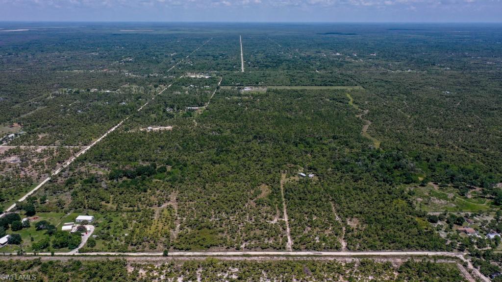 0 Benton Road Naples, FL 34117 - Photo 6 of 10 a view of a green field