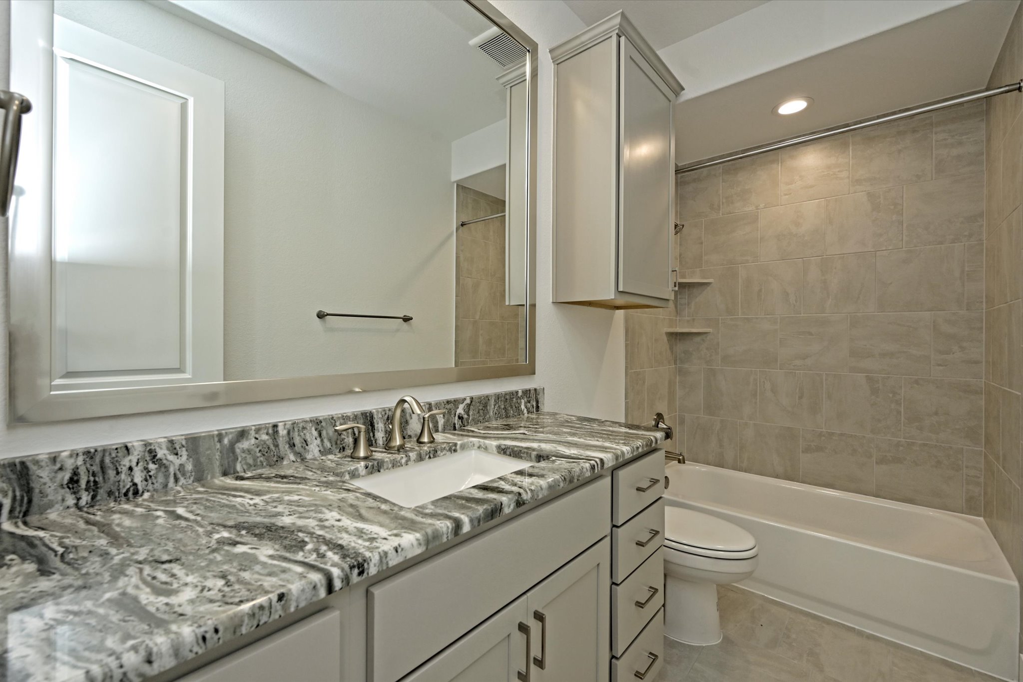 209 Scofield Avenue Georgetown, TX 78626 - Photo 26 of 33 a bathroom with a granite countertop sink a toilet and shower