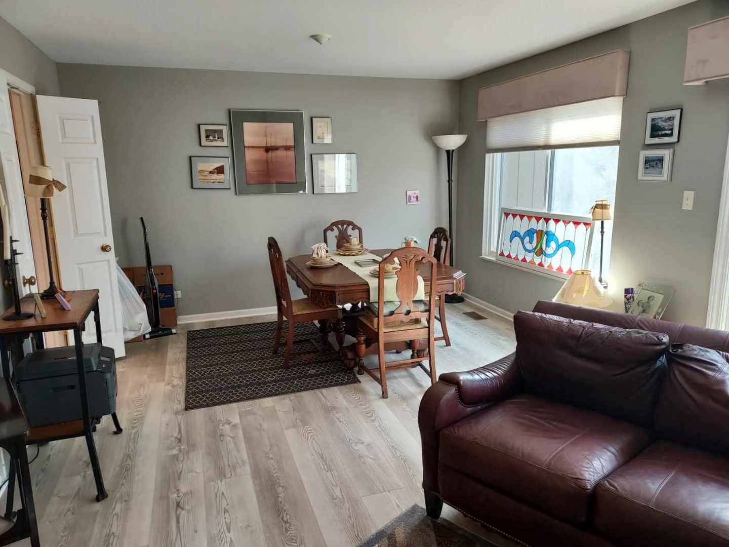 787 Oak Hill Road, Unit 467 Lake Barrington, IL 60010 - Photo 11 of 57 a living room with furniture and a wooden floor