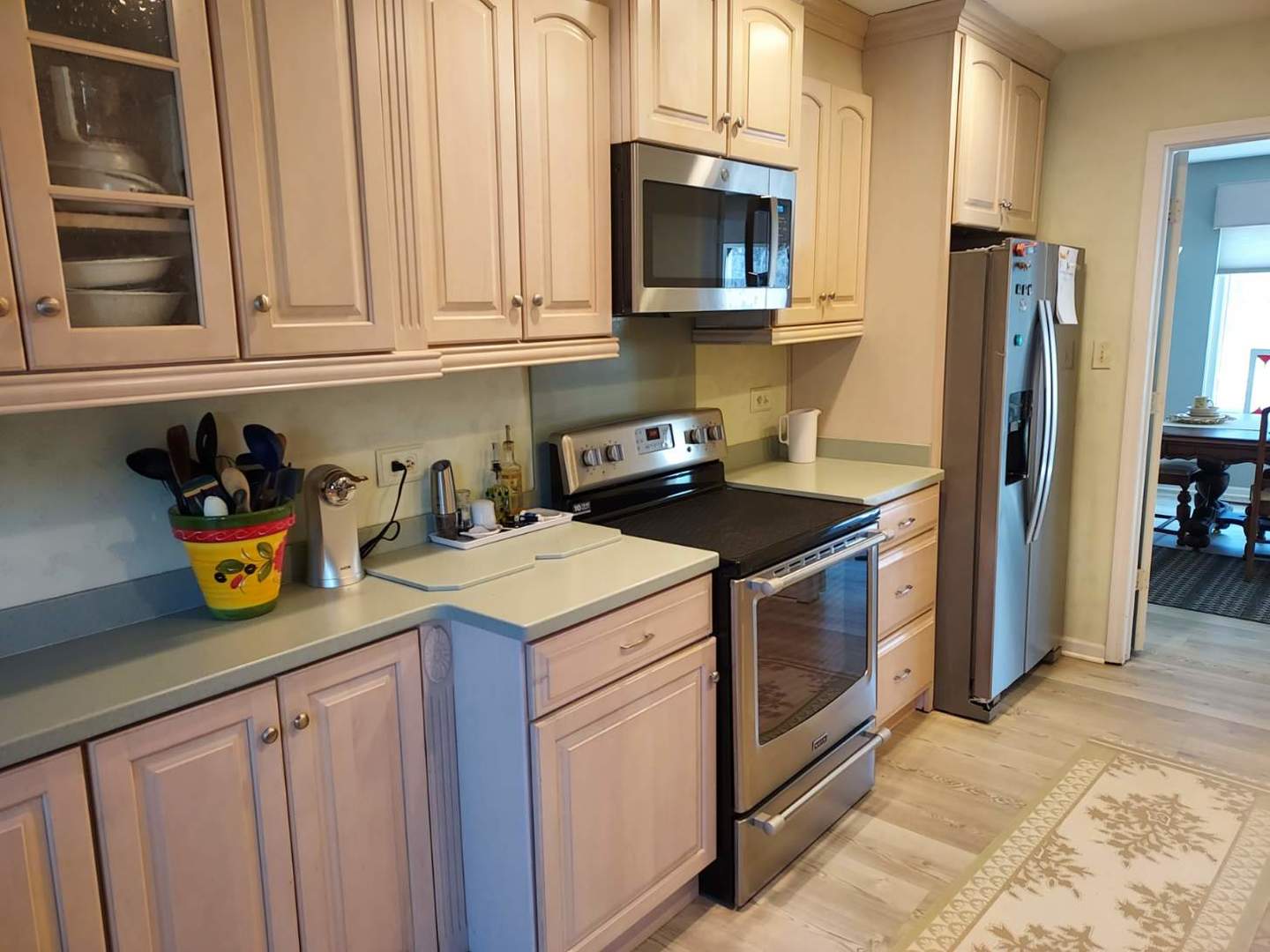 787 Oak Hill Road, Unit 467 Lake Barrington, IL 60010 - Photo 14 of 57 a kitchen with stainless steel appliances granite countertop a sink stove and refrigerator