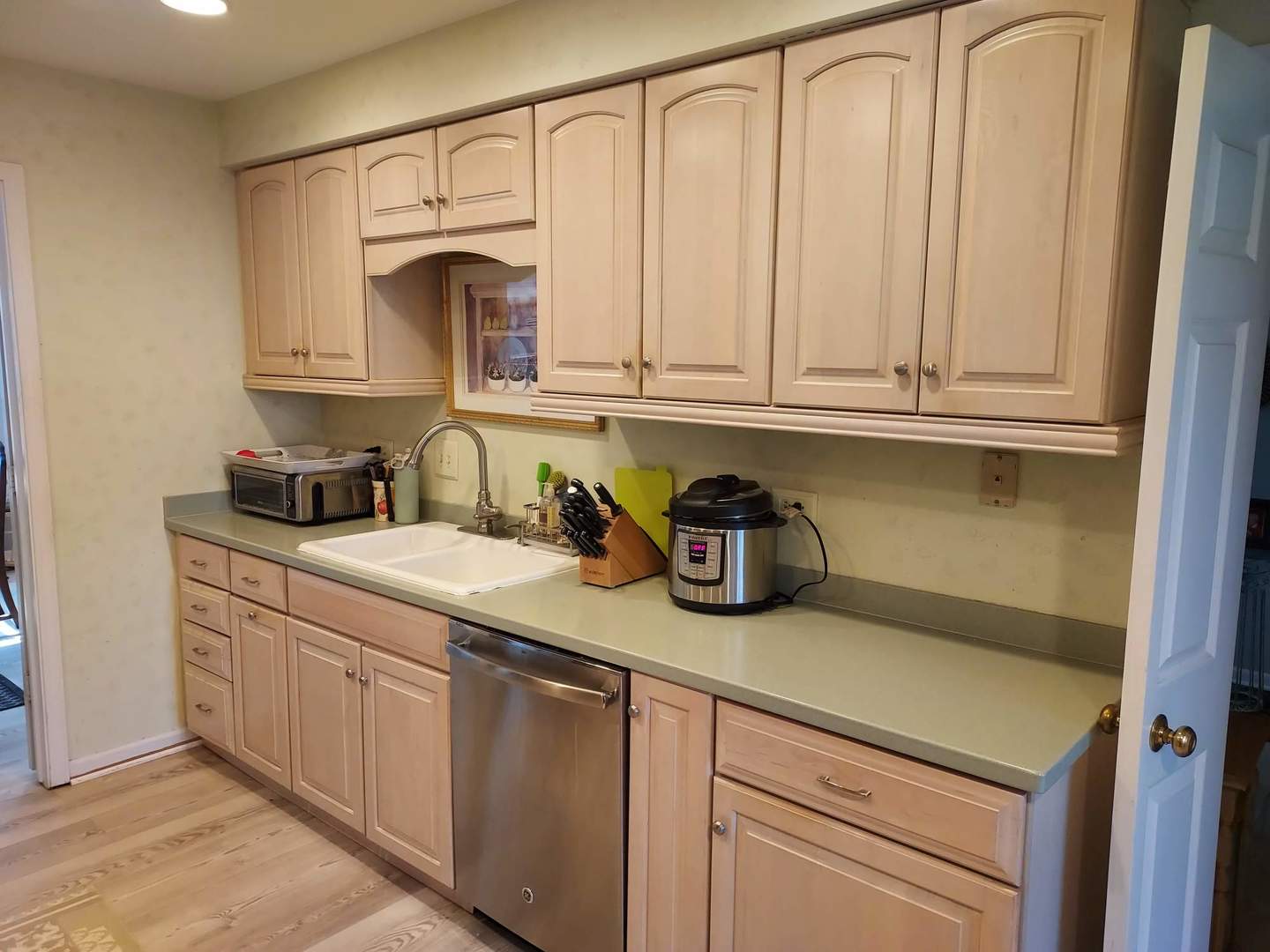 787 Oak Hill Road, Unit 467 Lake Barrington, IL 60010 - Photo 15 of 57 a kitchen with white cabinets and a sink