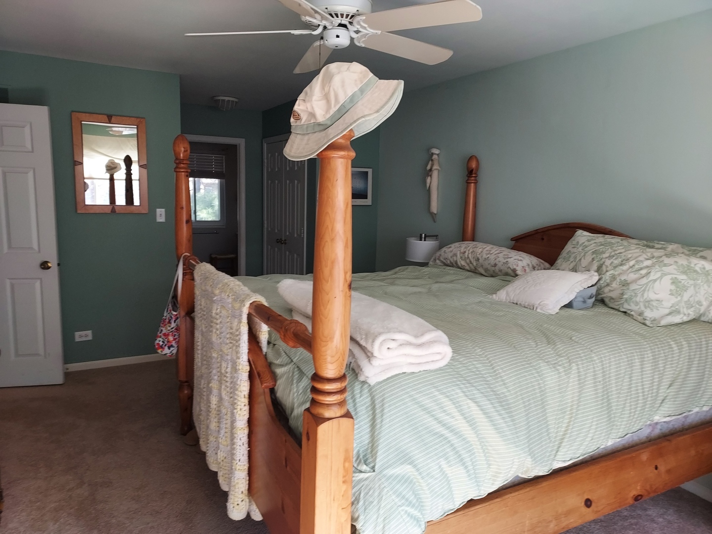 787 Oak Hill Road, Unit 467 Lake Barrington, IL 60010 - Photo 21 of 57 a bedroom with a bed and chandelier