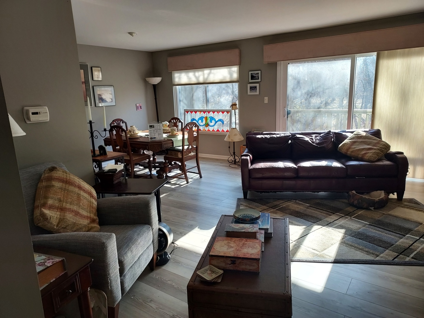 787 Oak Hill Road, Unit 467 Lake Barrington, IL 60010 - Photo 10 of 57 a living room with furniture and a large window