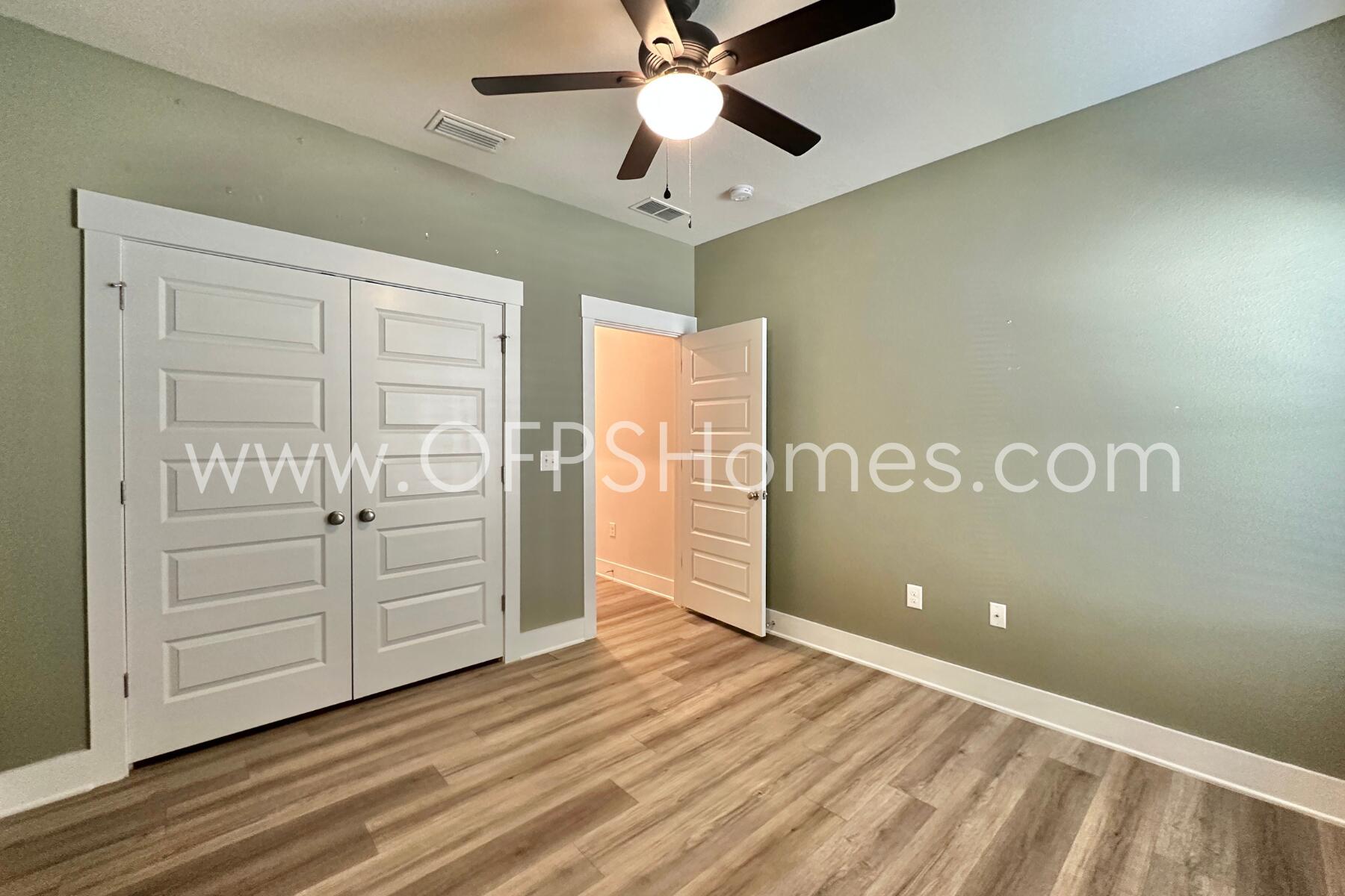 7422 Stagecoach Road Pensacola, FL 32526 - Photo 18 of 27 wooden floor in an empty room