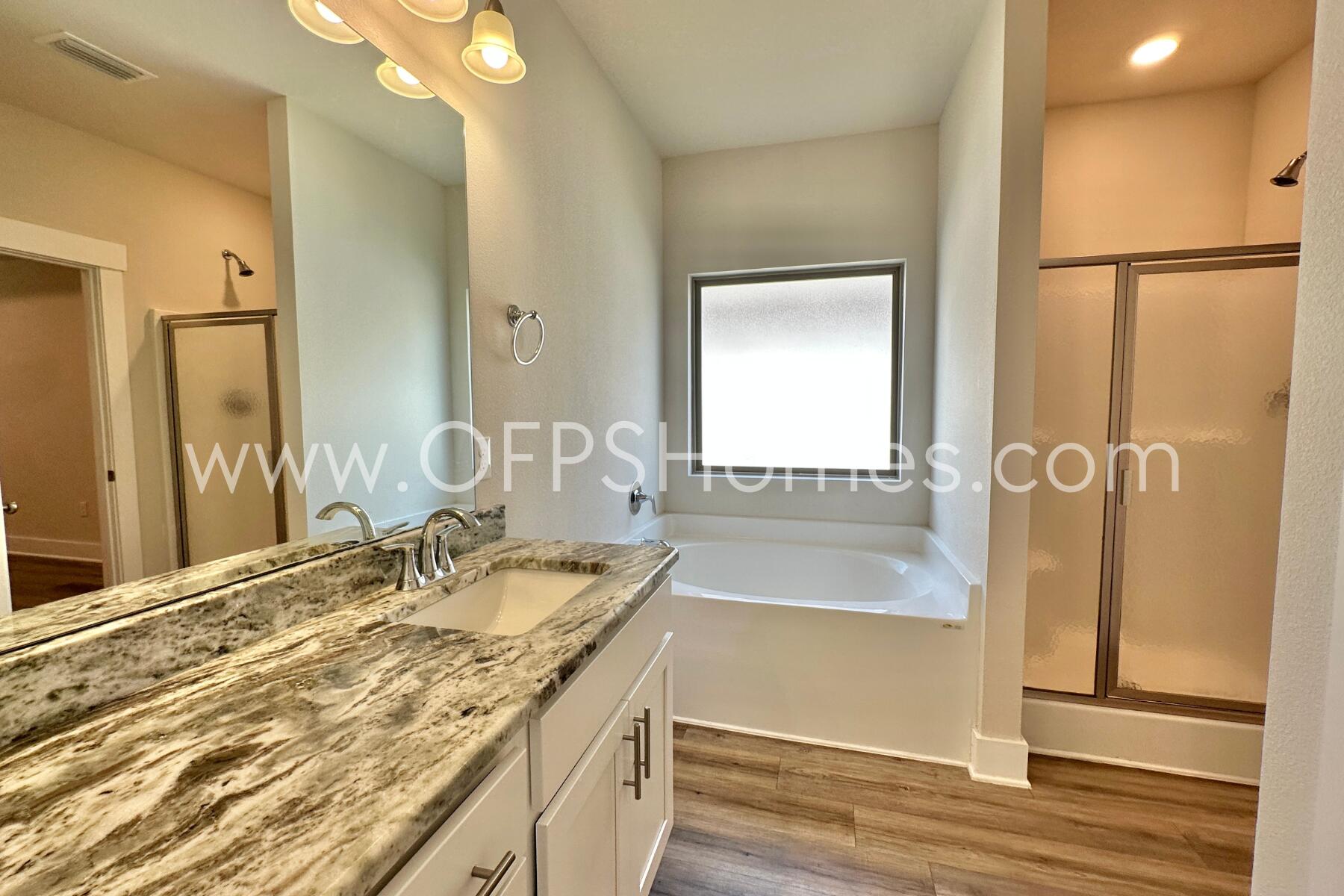 7422 Stagecoach Road Pensacola, FL 32526 - Photo 19 of 27 a bathroom with a granite countertop sink and a mirror