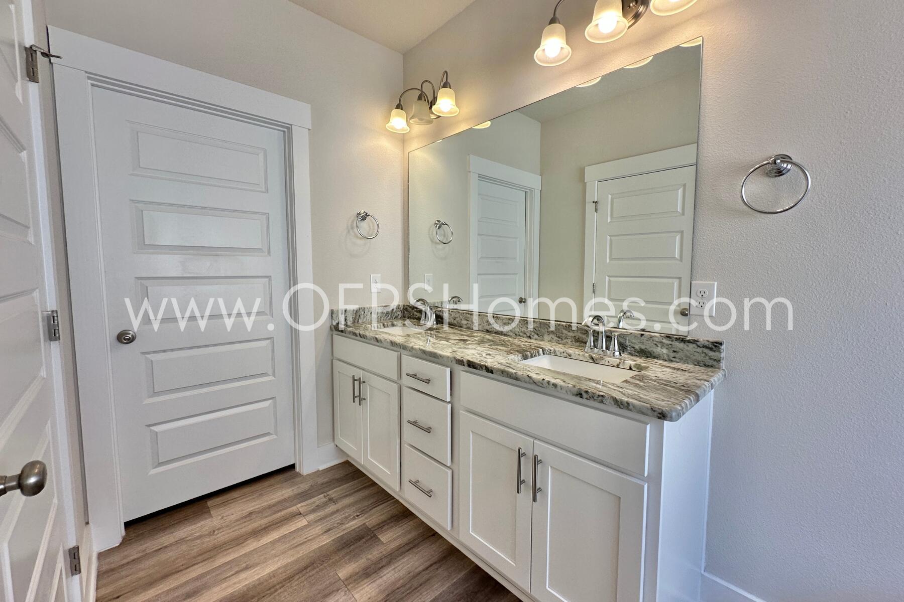 7422 Stagecoach Road Pensacola, FL 32526 - Photo 20 of 27 a bathroom with a granite countertop sink double vanity and a mirror
