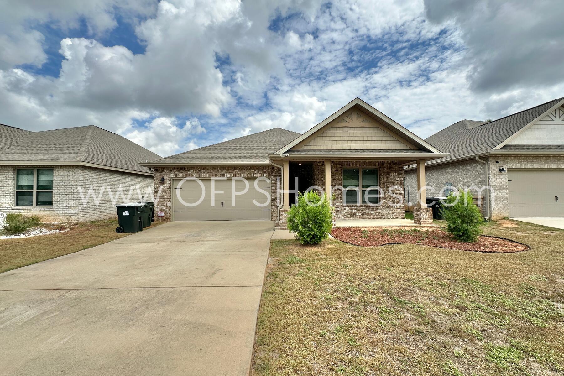 7422 Stagecoach Road Pensacola, FL 32526 - Photo 2 of 27 a front view of a house with garden
