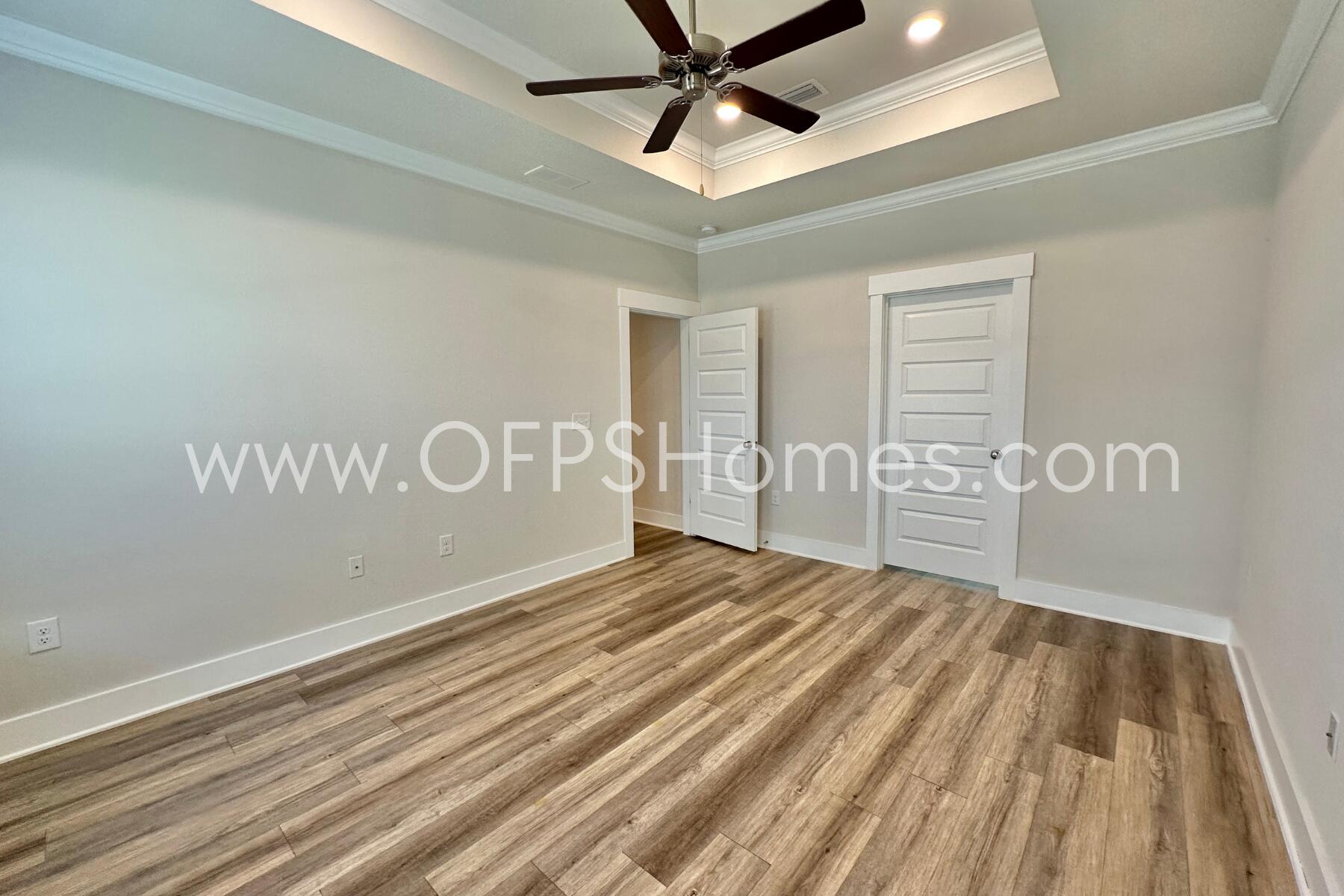 7422 Stagecoach Road Pensacola, FL 32526 - Photo 22 of 27 a view of a room with wooden floor and windows