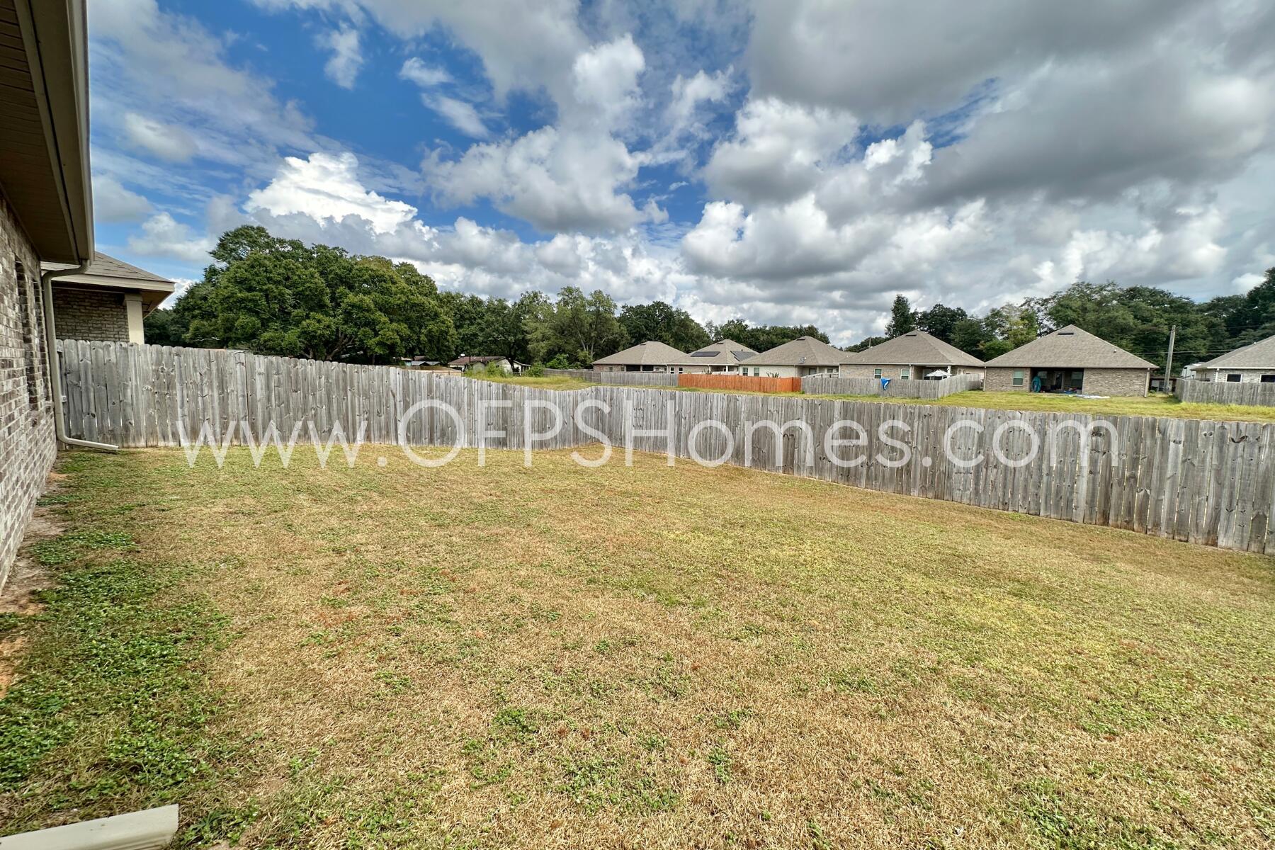7422 Stagecoach Road Pensacola, FL 32526 - Photo 24 of 27 a view of swimming pool with brick wall and fence