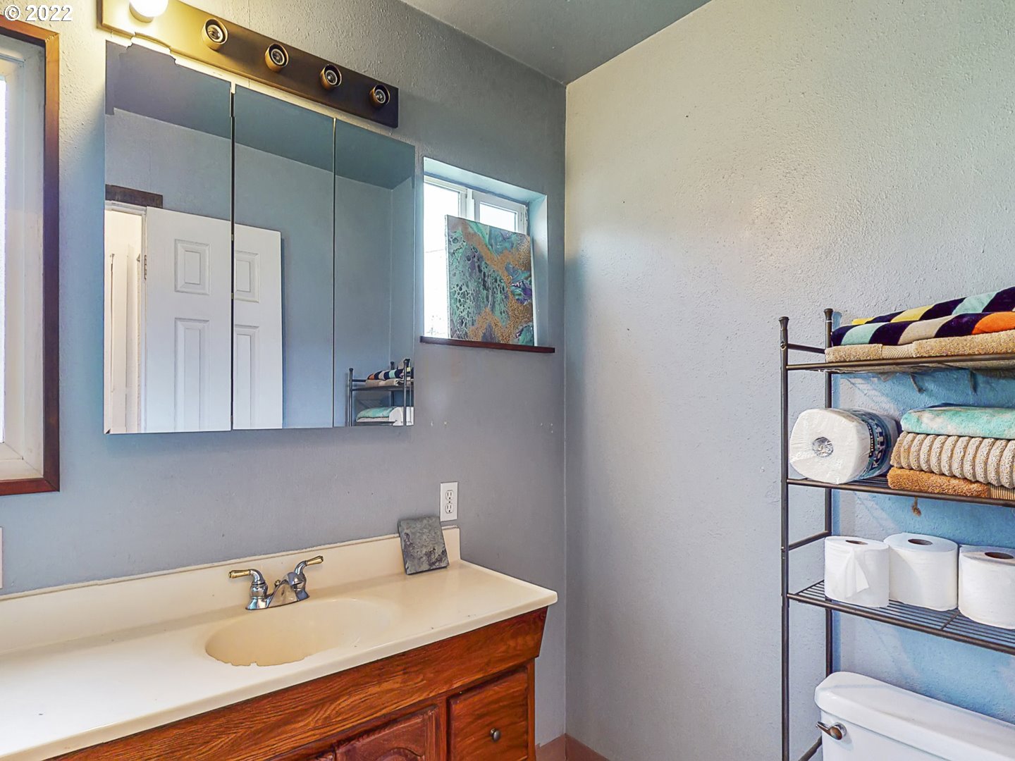 76423 River Road Oakridge, OR 97463 - Photo 25 of 30 a bathroom with a sink and a mirror