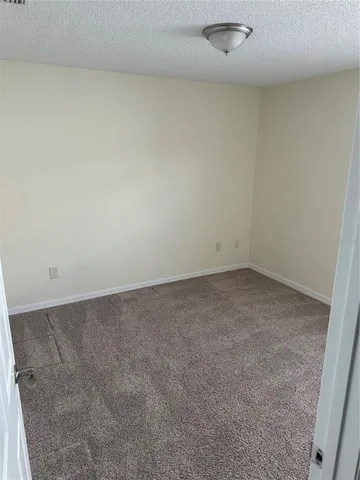 an empty room with a bench