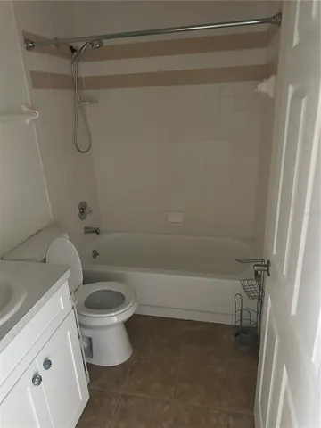 a bathroom with a shower and a toilet