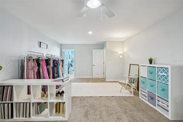 an aerial view of a house with a yard and lake view