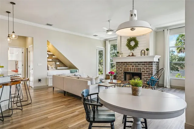 a living room with furniture and kitchen view