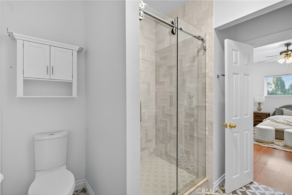 7582 McGroarty Terrace Los Angeles, CA 91042 - Photo 29 of 47 a bathroom with a shower and toilet