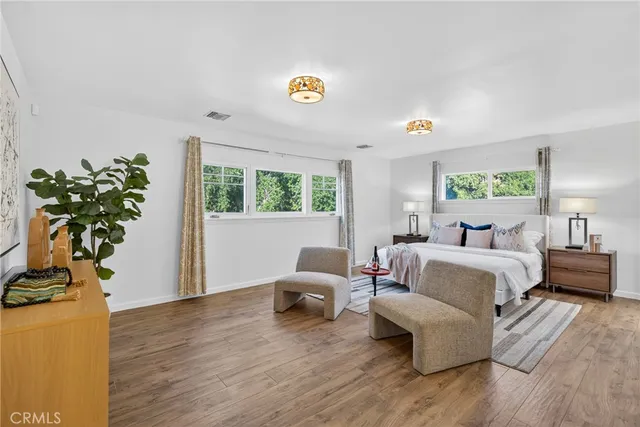 a bedroom with a bed and a couch