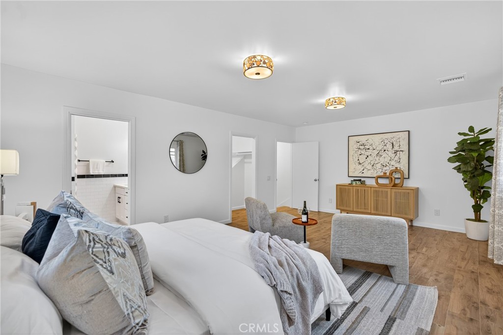 7582 McGroarty Terrace Los Angeles, CA 91042 - Photo 36 of 47 a bedroom with a bed and a couch