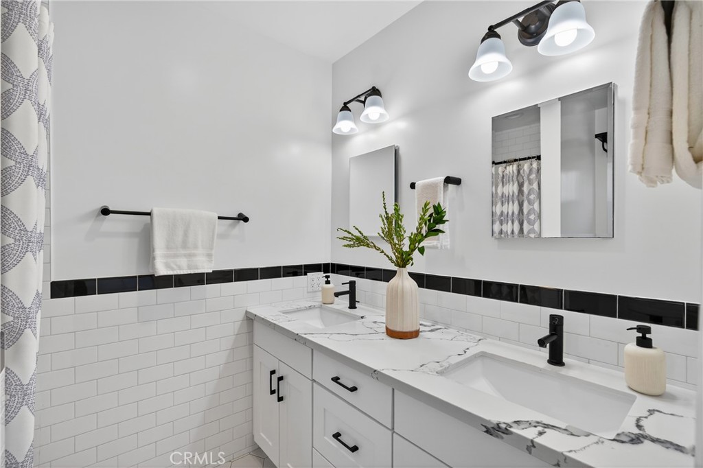 7582 McGroarty Terrace Los Angeles, CA 91042 - Photo 37 of 47 a bathroom with a sink and a mirror